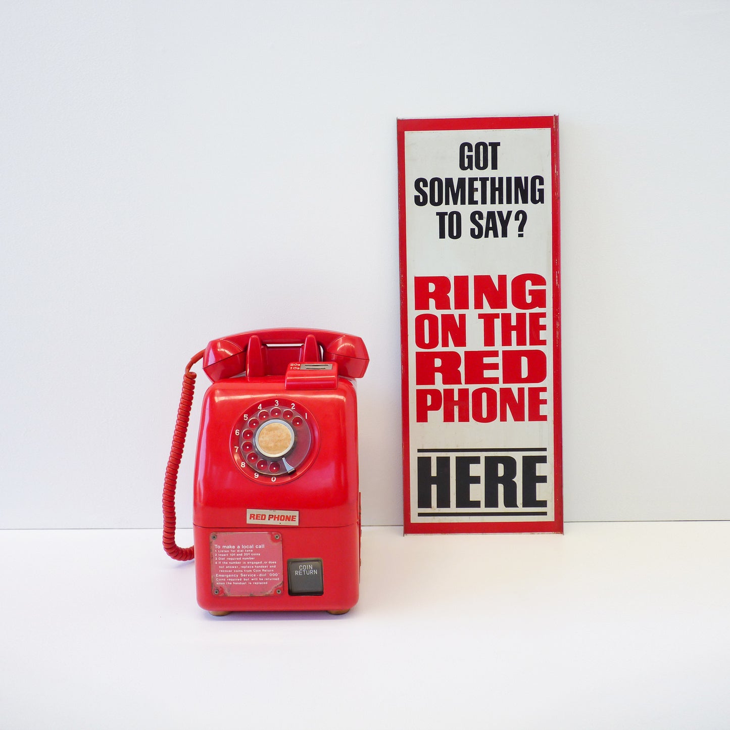 Vintage Red Payphone With Signage