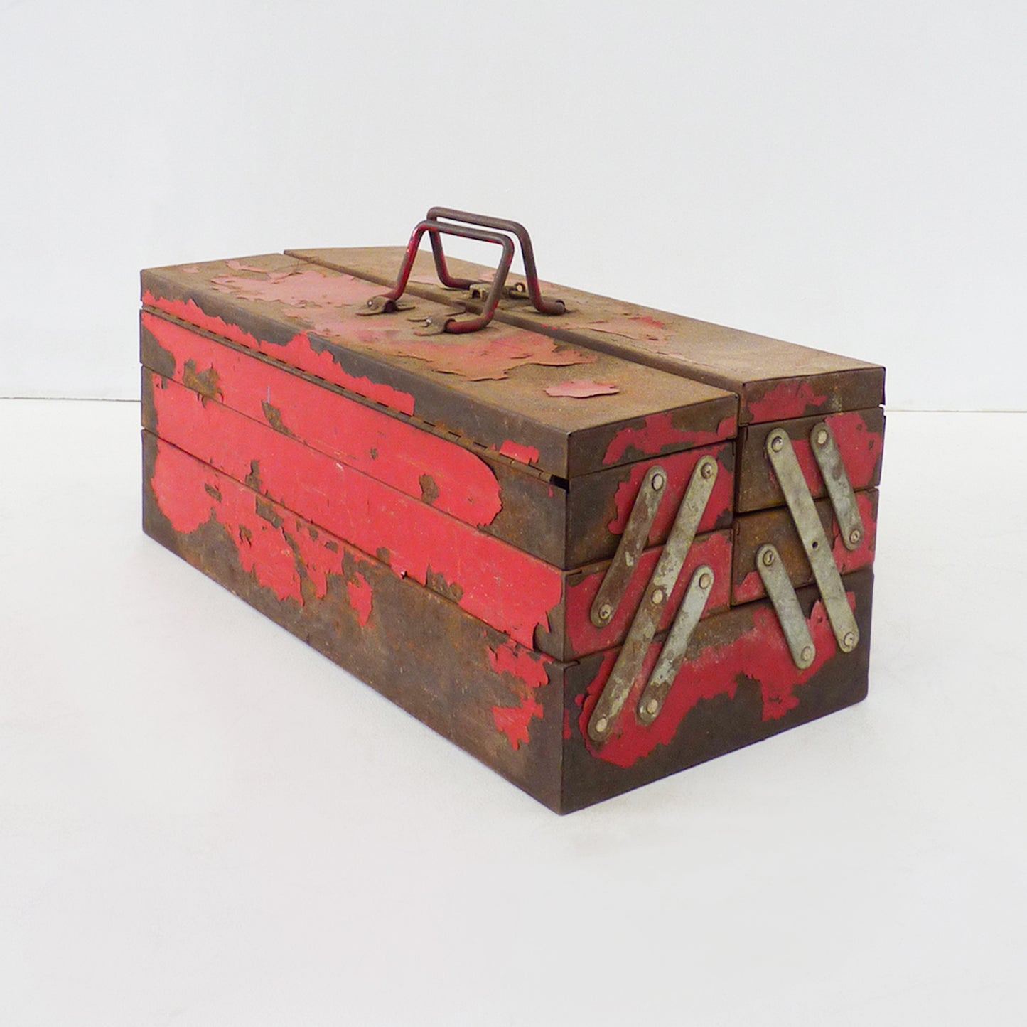 Aged Red Metal Expanding Toolbox