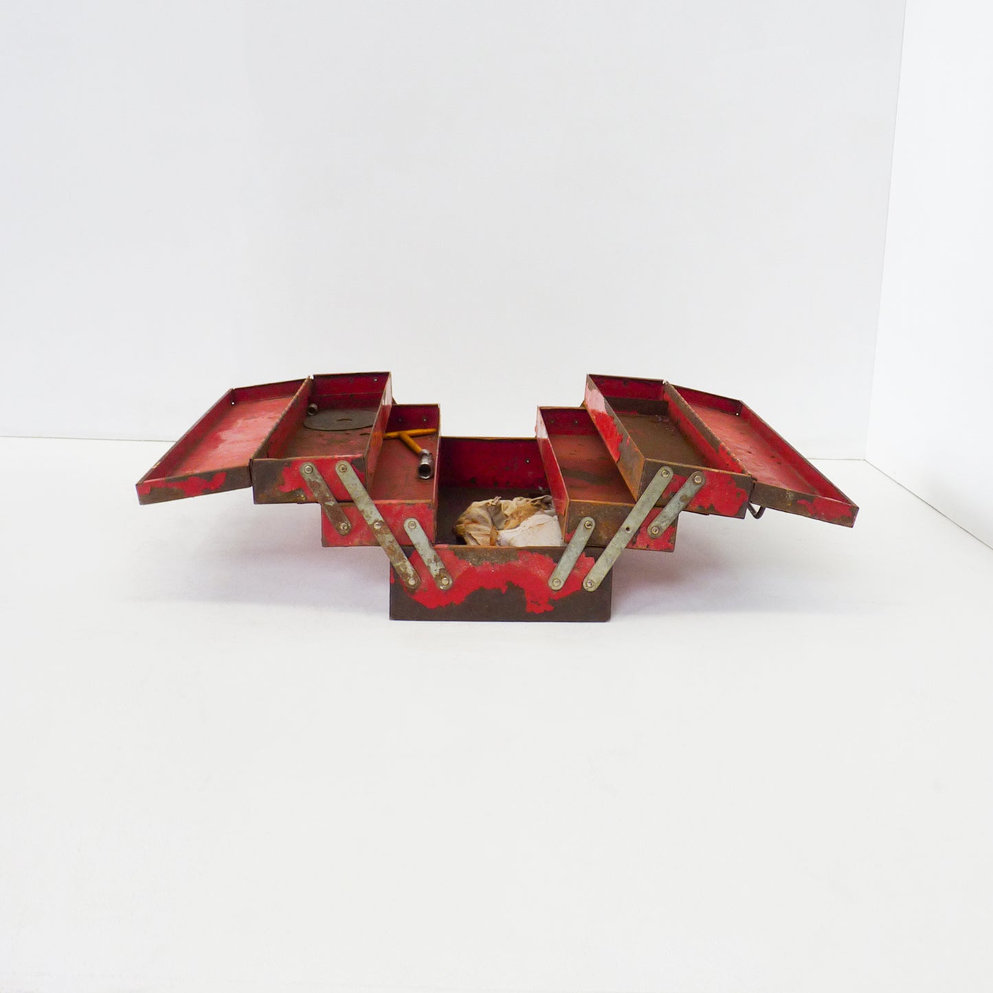 Aged Red Metal Expanding Toolbox