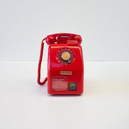 Vintage Red Payphone With Signage