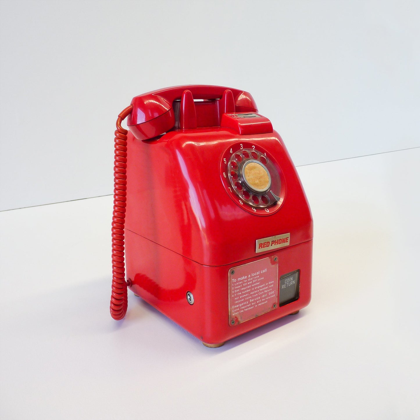 Vintage Red Payphone With Signage